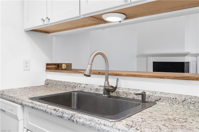 3518 Argo Ct, Virginia Beach, VA 23453 - room details featuring a fireplace, light stone countertops, white cabinets, dishwasher, and a sink