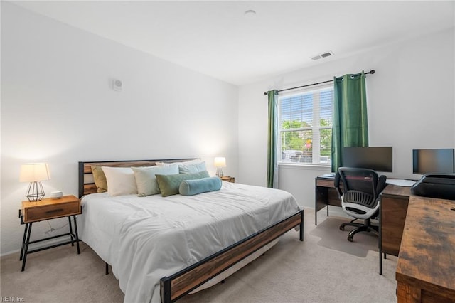 bedroom featuring light carpet, baseboards, and visible vents