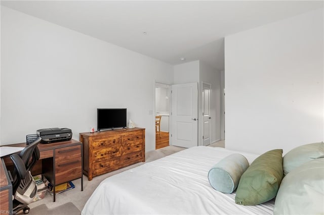 bedroom featuring light colored carpet