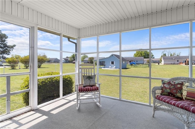 sunroom / solarium with a residential view