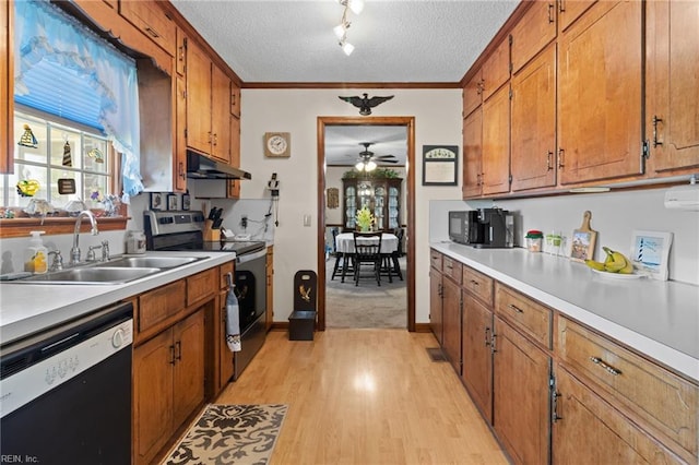 kitchen with light countertops, stainless steel range with electric stovetop, under cabinet range hood, dishwasher, and a sink