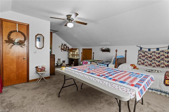 carpeted bedroom with a textured ceiling, baseboards, a ceiling fan, and vaulted ceiling