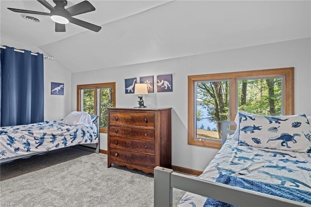 carpeted bedroom featuring visible vents, baseboards, a ceiling fan, and lofted ceiling