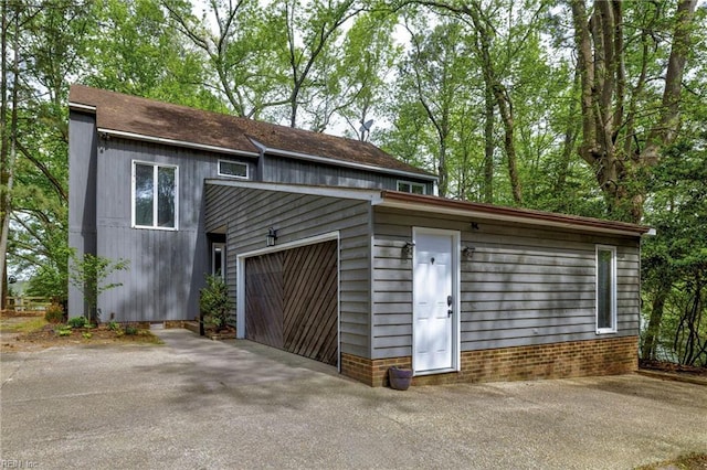 garage with aphalt driveway
