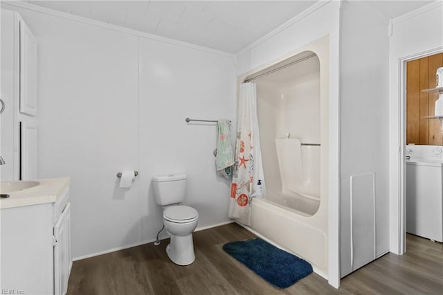 bathroom featuring washer / dryer, ornamental molding, toilet, and wood finished floors