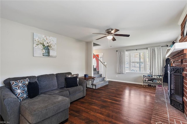 78 Kendall Dr, Newport News, VA 23601 - living room featuring wood finished floors, baseboards, a fireplace, stairs, and ceiling fan