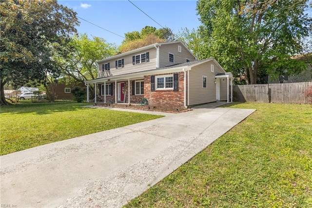 78 Kendall Dr, Newport News, VA 23601 - traditional-style house featuring driveway, fence, a porch, a front yard, and brick siding
