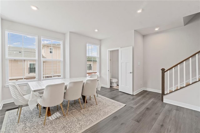 dining room featuring recessed lighting, stairs, baseboards, and dark wood finished floors