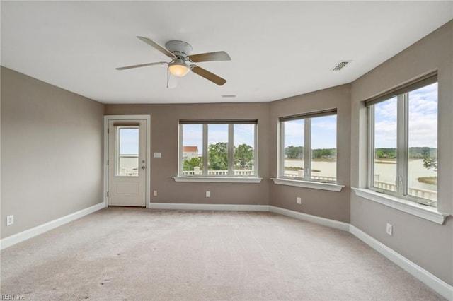 89 Sandy Bay Dr, Poquoson, VA 23662 - spare room featuring light colored carpet, a wealth of natural light, and visible vents