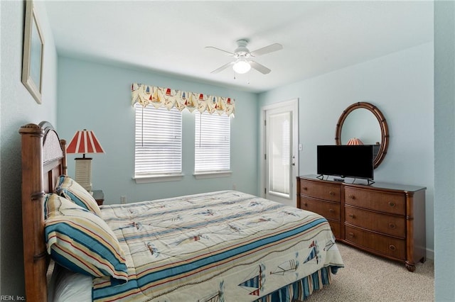 206 E Palmetto St, Kill Devil Hills, NC 27948 - bedroom with ceiling fan and light carpet