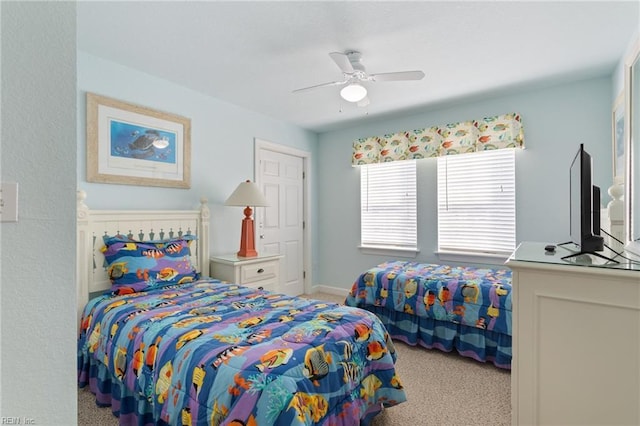 206 E Palmetto St, Kill Devil Hills, NC 27948 - bedroom with carpet flooring, baseboards, and ceiling fan