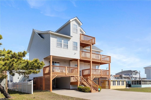 206 E Palmetto St, Kill Devil Hills, NC 27948 - back of property with a carport, stairway, and driveway
