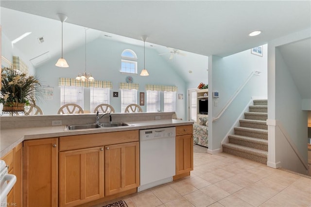 206 E Palmetto St, Kill Devil Hills, NC 27948 - kitchen featuring light tile patterned floors, dishwasher, a sink, and hanging light fixtures