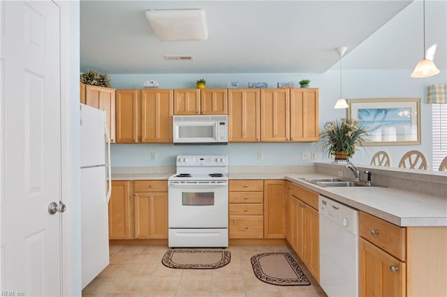 206 E Palmetto St, Kill Devil Hills, NC 27948 - kitchen featuring light countertops, a peninsula, a sink, and white appliances