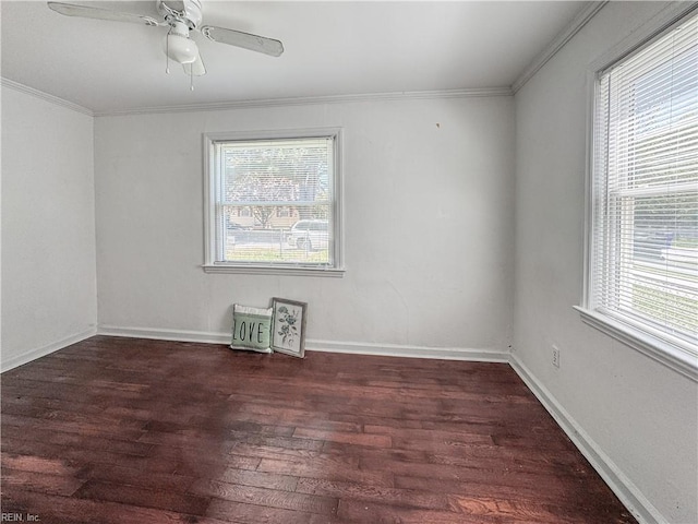 unfurnished room with wood finished floors, a wealth of natural light, and crown molding