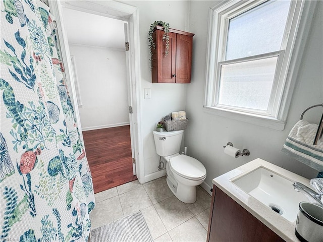 full bath with vanity, curtained shower, baseboards, toilet, and tile patterned flooring