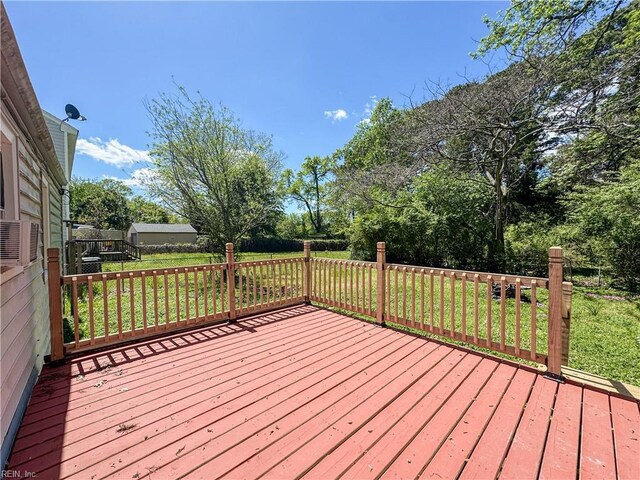 wooden deck with a lawn
