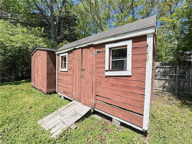 view of shed with fence