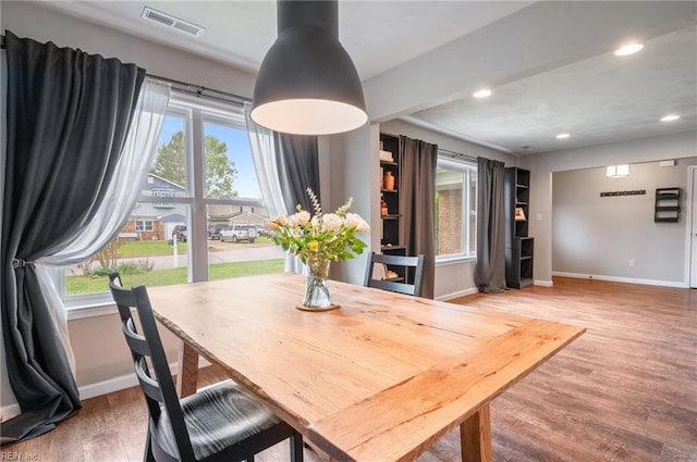dining room featuring visible vents, baseboards, and a wealth of natural light