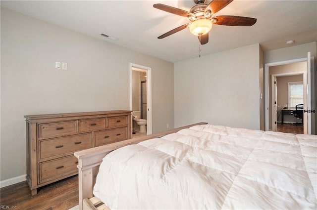 bedroom with wood finished floors, visible vents, a ceiling fan, baseboards, and ensuite bathroom