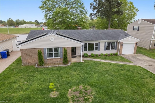 ranch-style home with an attached garage, a front lawn, driveway, and brick siding