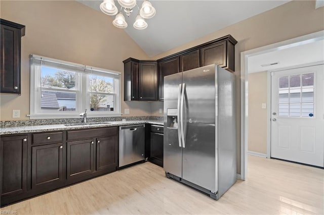 1405 Perry St, Chesapeake, VA 23324 - kitchen featuring light wood-style floors, appliances with stainless steel finishes, a sink, and vaulted ceiling