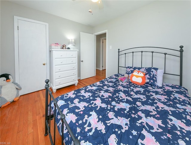 bedroom with wood finished floors and ceiling fan