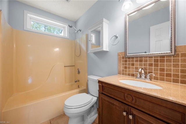 full bath with tasteful backsplash, tile patterned floors, vanity,  shower combination, and toilet