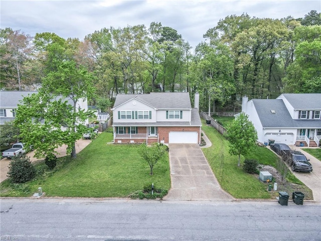 view of front facade with concrete driveway, an attached garage, brick siding, and a front yard