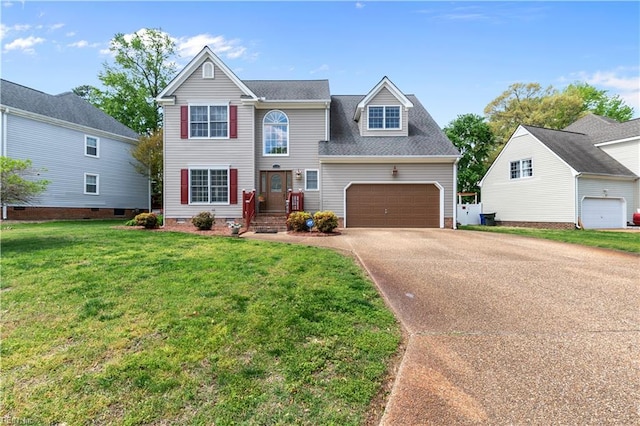 traditional-style house featuring an attached garage, a front lawn, and concrete driveway