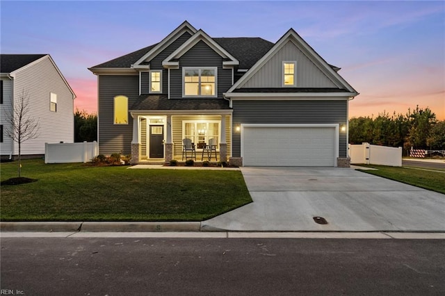 craftsman house featuring fence, a yard, concrete driveway, an attached garage, and a porch
