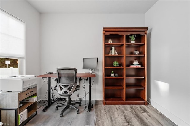 office space featuring wood finished floors and baseboards
