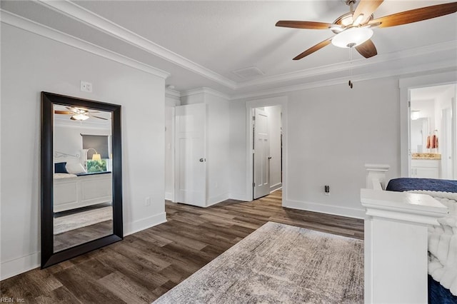 interior space with wood finished floors, ornamental molding, baseboards, and ceiling fan