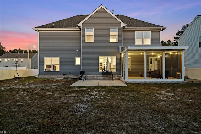 rear view of property with a patio area, a sunroom, and fence