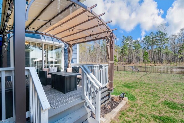 wooden deck with a pergola, a fenced backyard, outdoor lounge area, and a yard