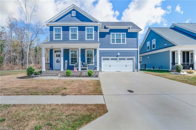 craftsman house with a porch, a front lawn, driveway, and a garage