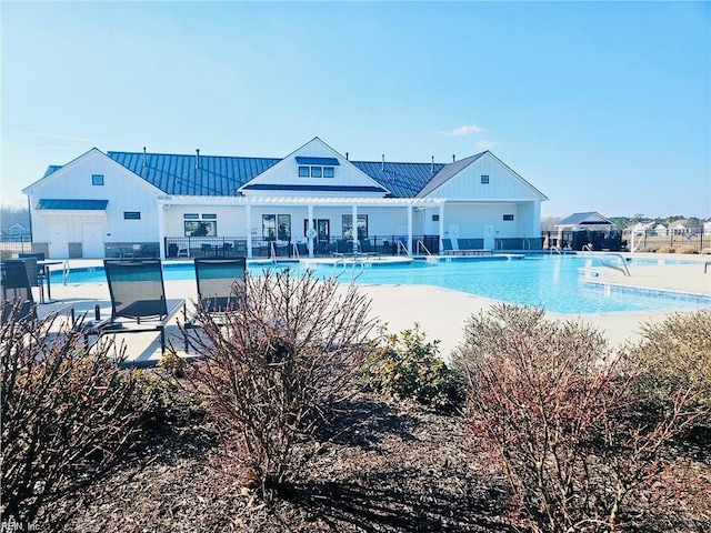 pool featuring fence and a patio area