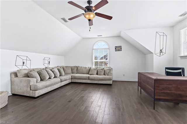 living area featuring visible vents, vaulted ceiling, dark wood-style floors, and ceiling fan