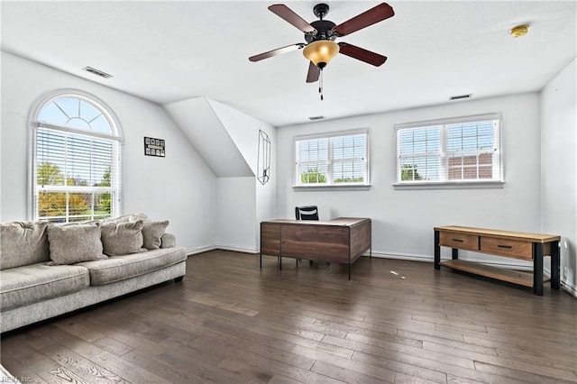 interior space featuring wood-type flooring, baseboards, a ceiling fan, and visible vents