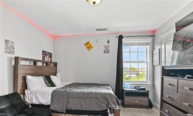 bedroom featuring visible vents and carpet
