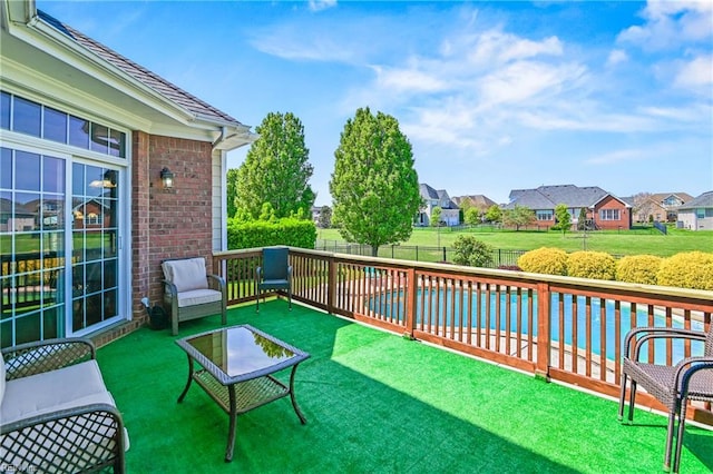 view of patio / terrace with a fenced backyard and a residential view