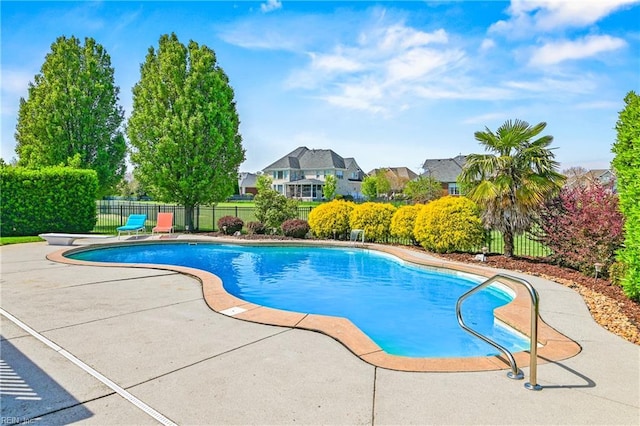 view of swimming pool with fence, a diving board, a patio, and a fenced in pool