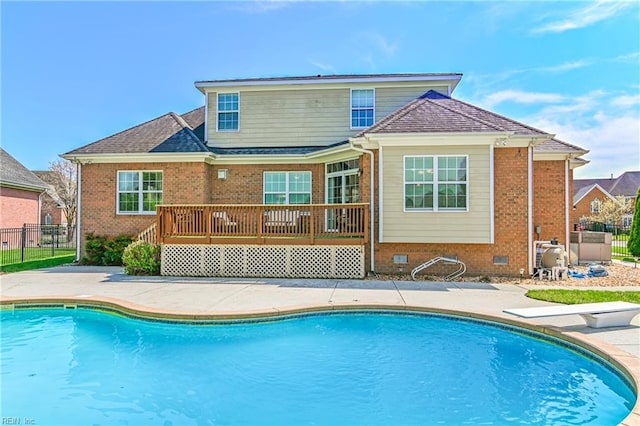 view of pool featuring fence, a patio, a fenced in pool, and a deck