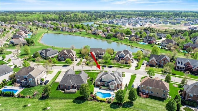 birds eye view of property featuring a residential view and a water view
