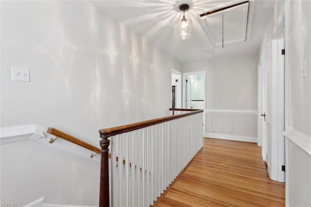24 Holly Dr, Newport News, VA 23601 - corridor with attic access, a wainscoted wall, an upstairs landing, and light wood-type flooring