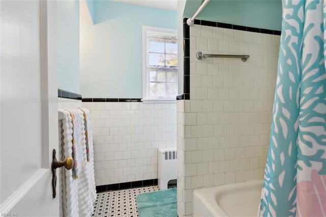 24 Holly Dr, Newport News, VA 23601 - bathroom featuring wainscoting, radiator, shower / bath combo with shower curtain, and tile walls