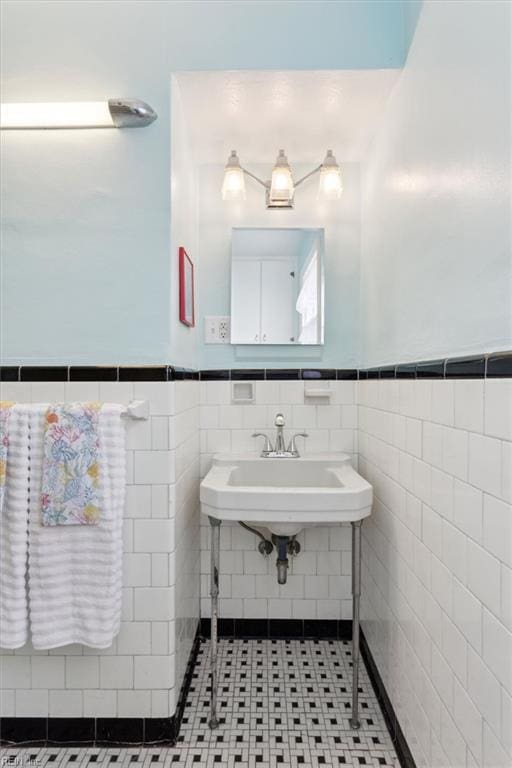 24 Holly Dr, Newport News, VA 23601 - bathroom with a wainscoted wall, a sink, and tile walls
