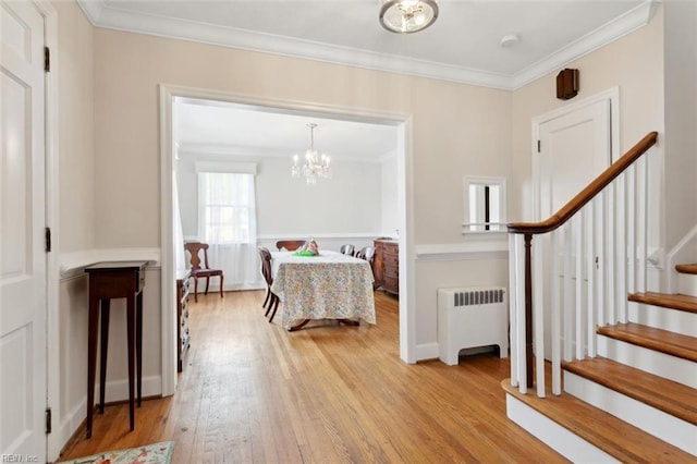 24 Holly Dr, Newport News, VA 23601 - foyer entrance featuring stairway, radiator heating unit, light wood-type flooring, an inviting chandelier, and ornamental molding