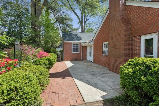 24 Holly Dr, Newport News, VA 23601 - view of side of home with brick siding and cooling unit