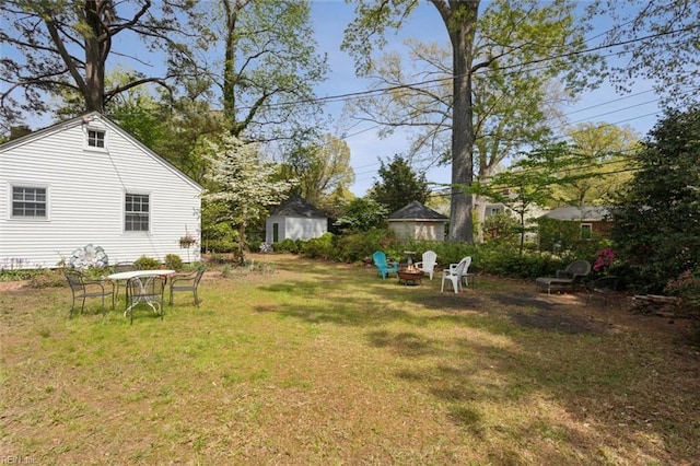 24 Holly Dr, Newport News, VA 23601 - view of yard with an outdoor fire pit and an outbuilding